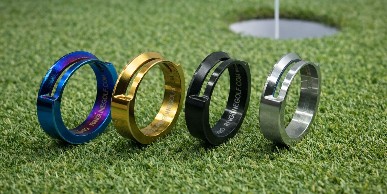 RingLine golf ball alignment rings in multiple color finishes displayed on a putting green near a hole.
